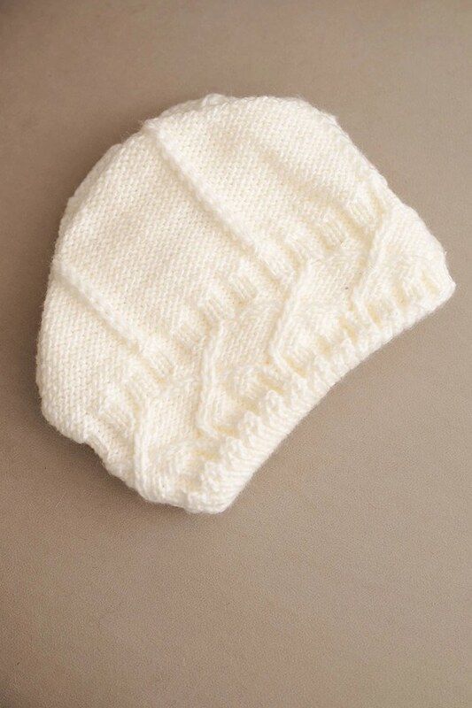 KESI Kepurė vilnonė pintu raštu Kamea – šilumai ir jaukumui žiemos dienomis.